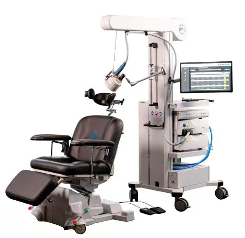 TMS therapy chair with stimulation equipment.