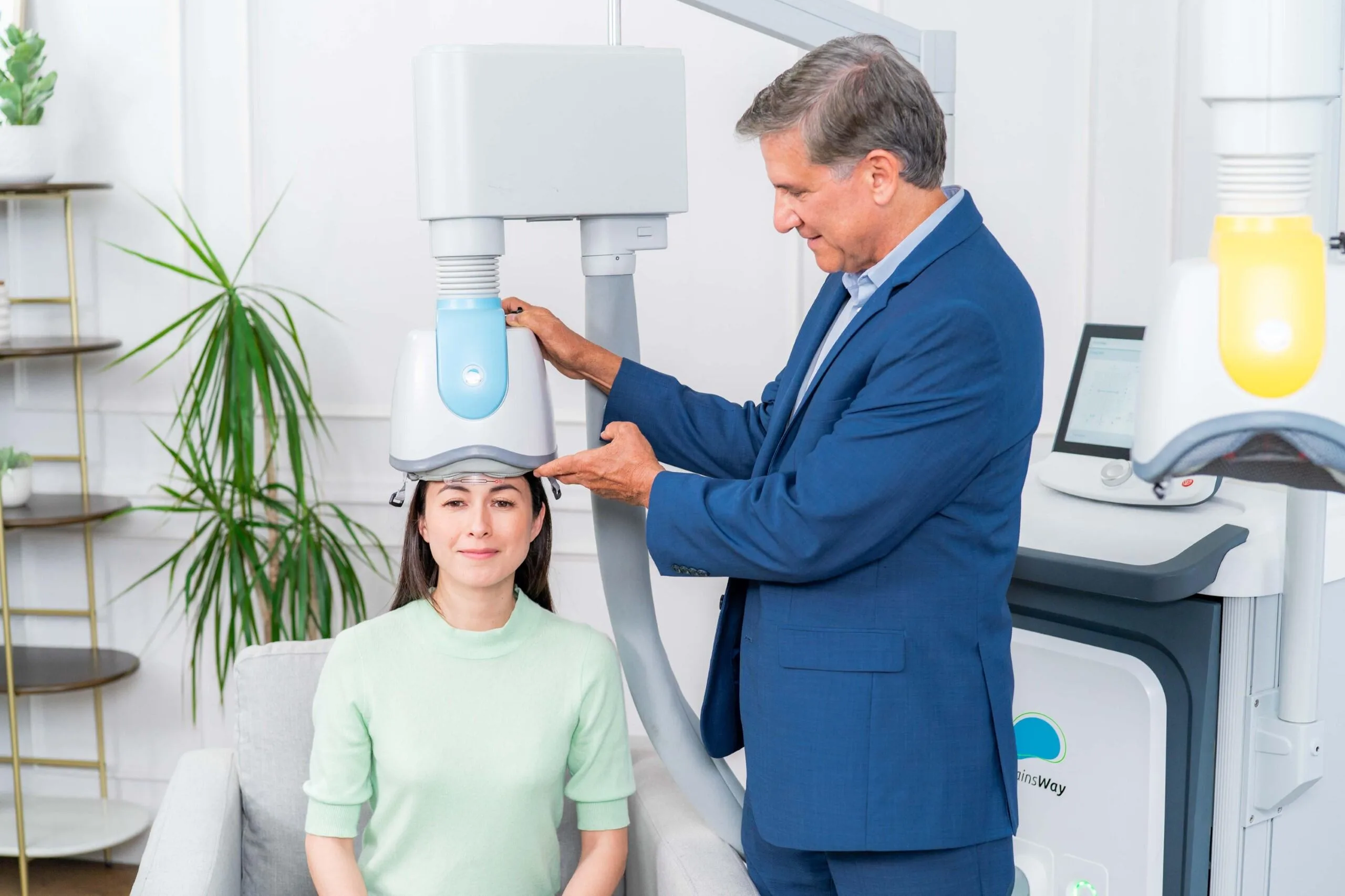 Clinician preparing patient for TMS